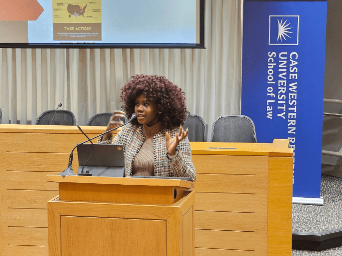 Conner standing in the Moot Courtroom during the presentation