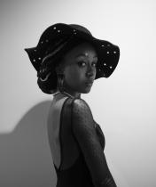 Headshot of Devin in black and white