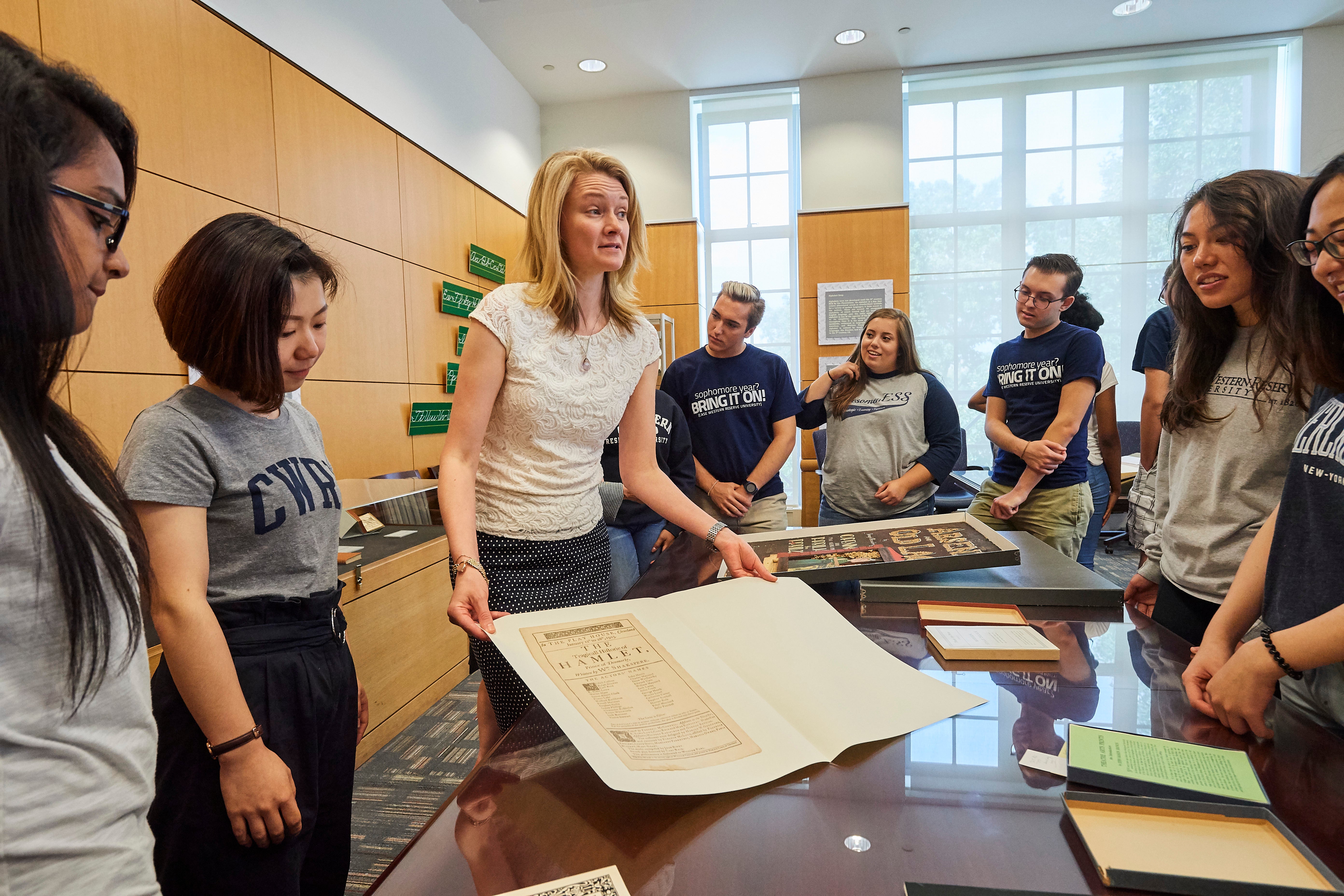 Students and Staff Looking at Documents in the Special Collections Hatch Reading Room.