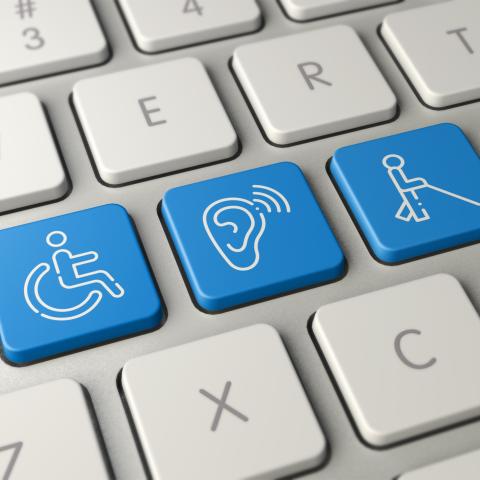 keyboard with blue keys signaling accessibility - picture of wheelchair, ear and person with walker