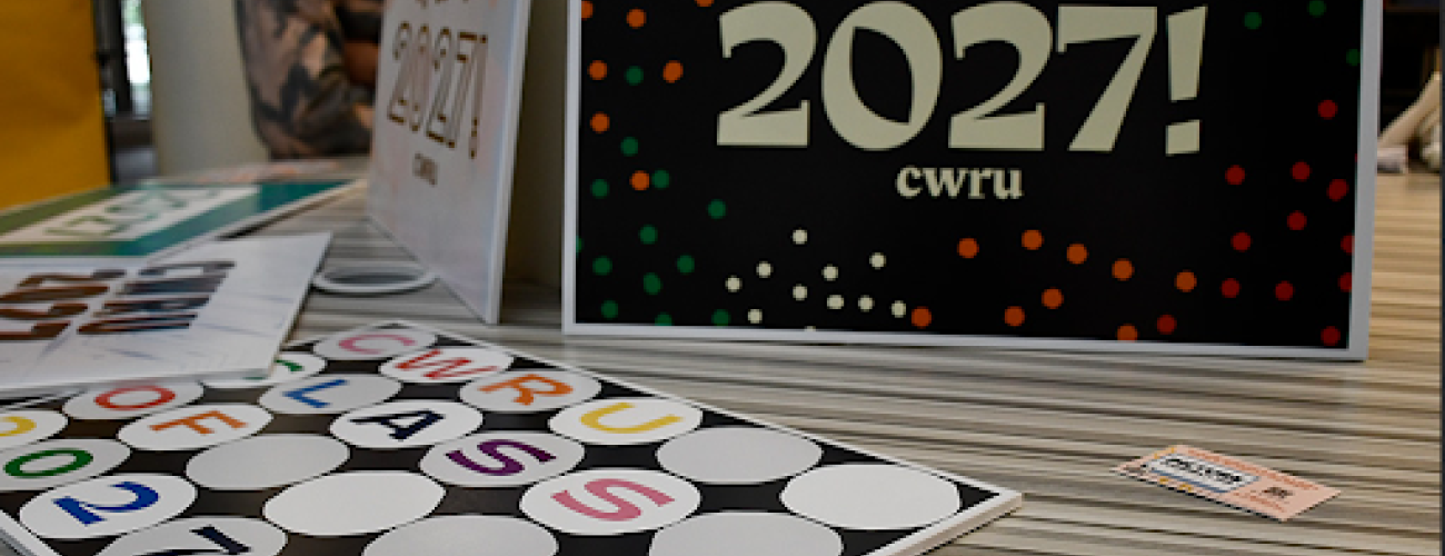 Multiple welcome signs on a table with words 'Class of 2027!' cwru