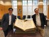 faculty member and librarian with Gregorian music book