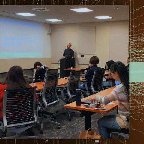 Instructor teaching in front of class of students