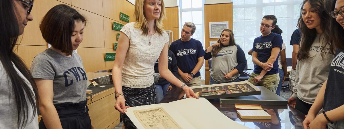 Students and Staff Looking at Documents in the Special Collections Hatch Reading Room.