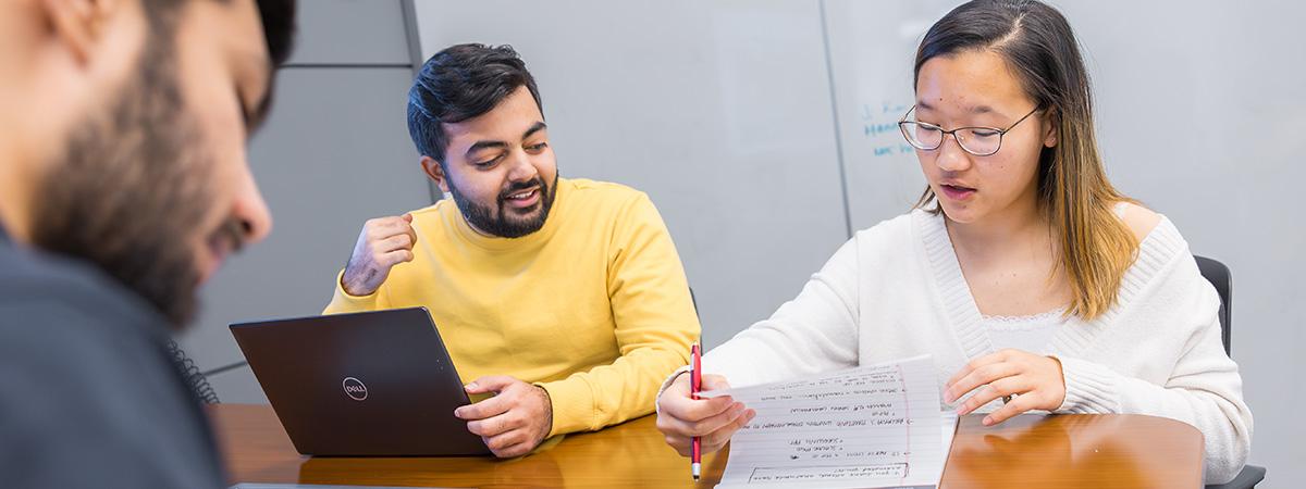 Students collaborate at a table at Kelvin Smith Library