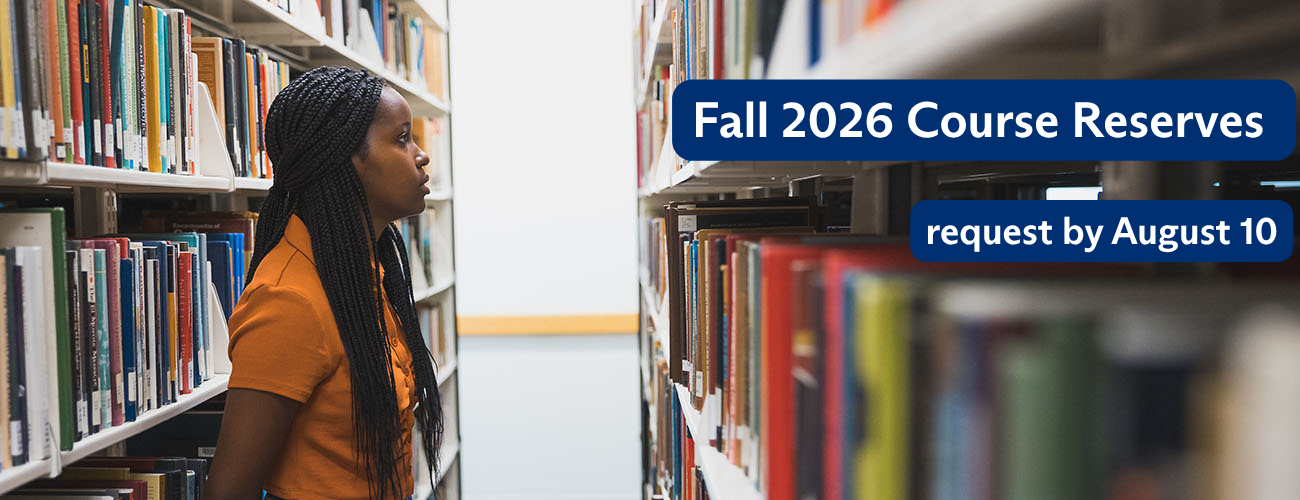 Student browses a bookshelf at Kelvin Smith Library.