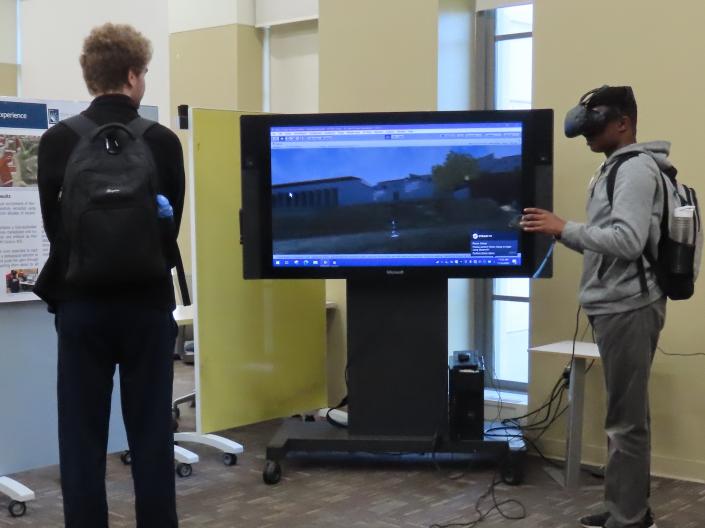 Students in front of screen with VR glasses
