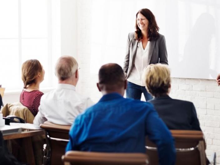 A group of people talking in a class