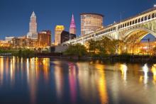 Skyline of Cleveland at night with the lake in front
