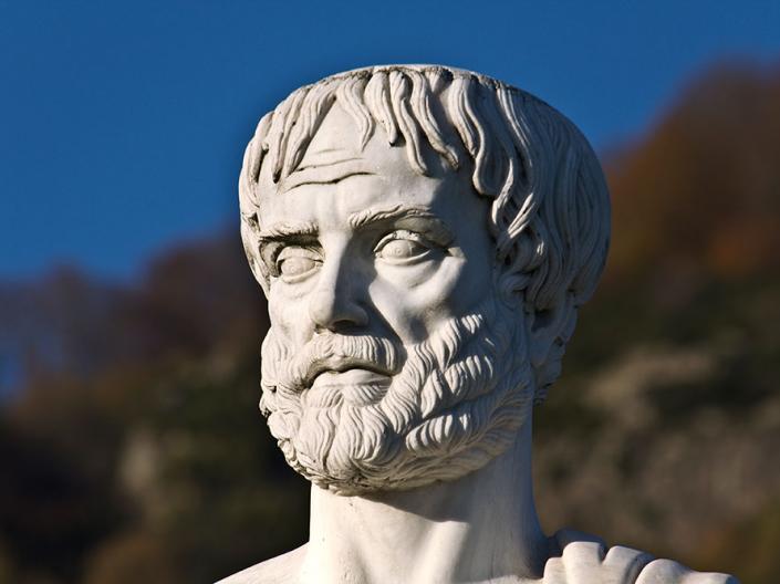 Sculpture of Aristotole on a sunny day