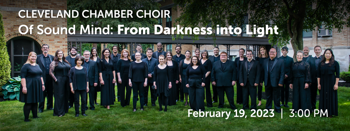 choral ensemble dressed in black posed in group shot