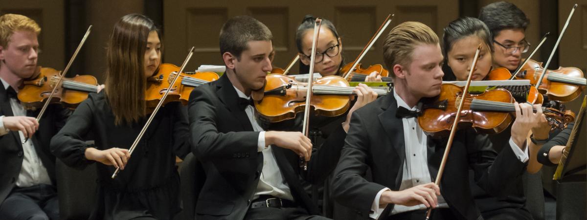 Case/University Circle orchestra members playing instruments