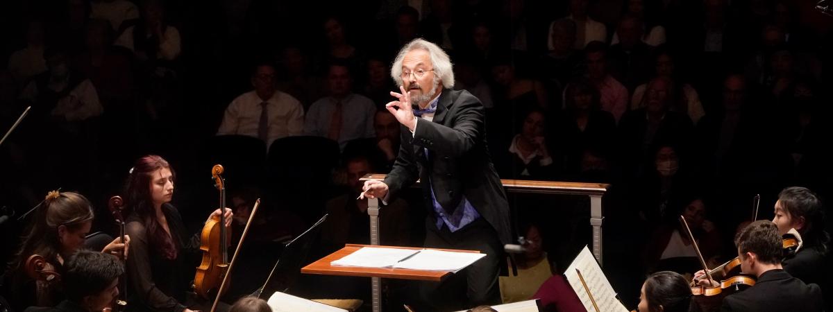 conductor directing the orchestra during a CIM concert