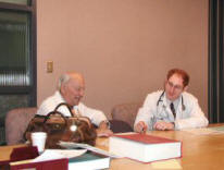 Dr. Monroe Cole, Emeritus Professor of Neurology, supervising the Resident's Continuity Clinic