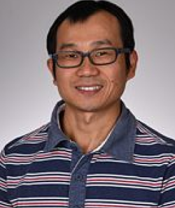 Dr. Gan in striped shirt