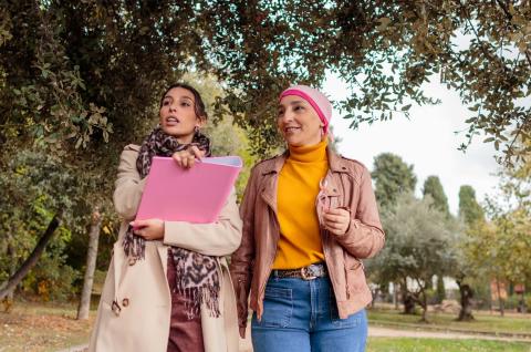 two happy women walking