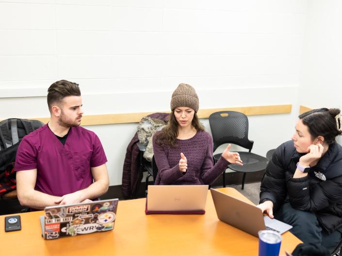 Students collaborating with computers