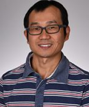 Dr. Gan in striped shirt