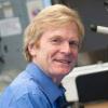 Image of Dr. Walsh at a microscope