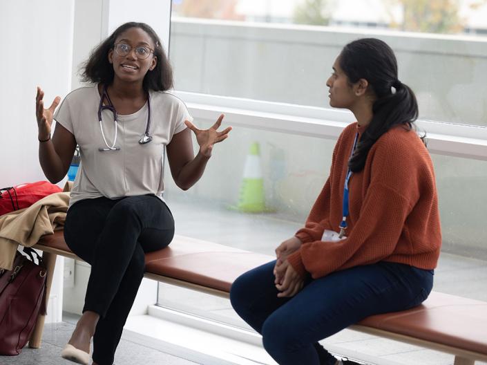 Student and teacher speaking at the Case Western Reserve School of Medicine