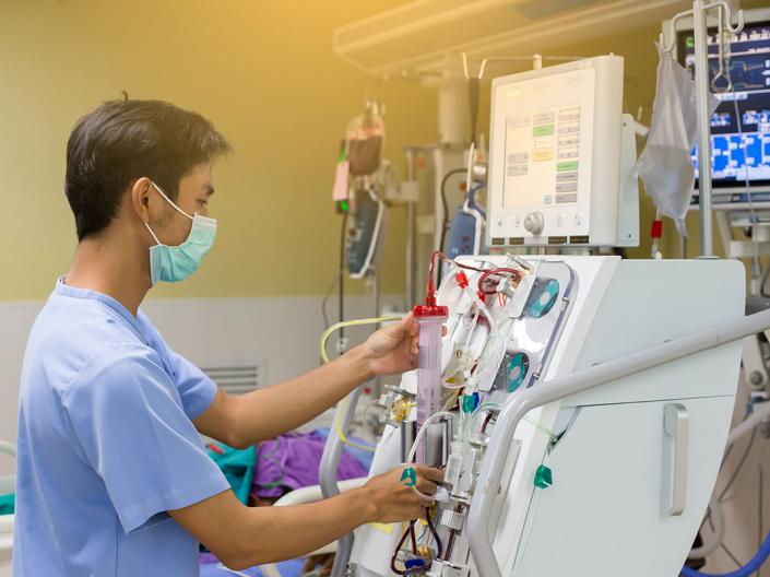 Kidney specialist are doing continuous renal replacement therapy equipment and injection pump.