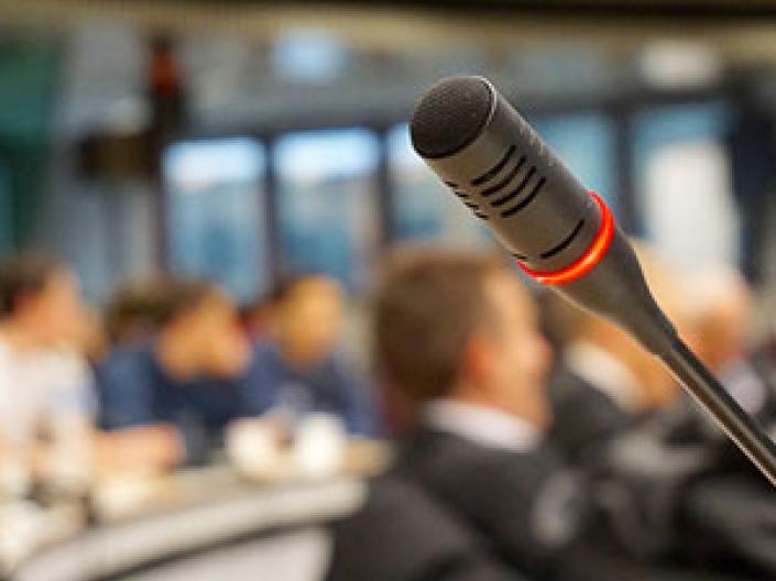 Closeup of a microphone at a conference