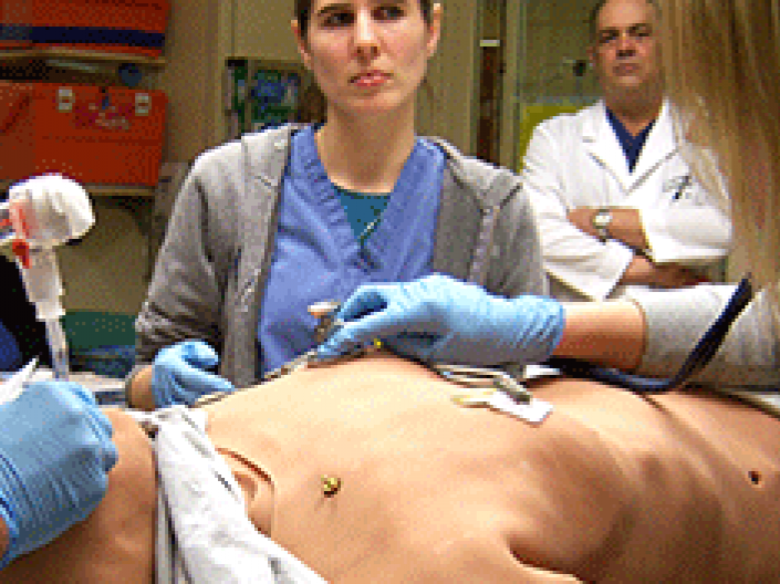A student learning on a simulation dummy