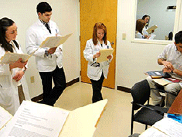 A group of students reading over a case file