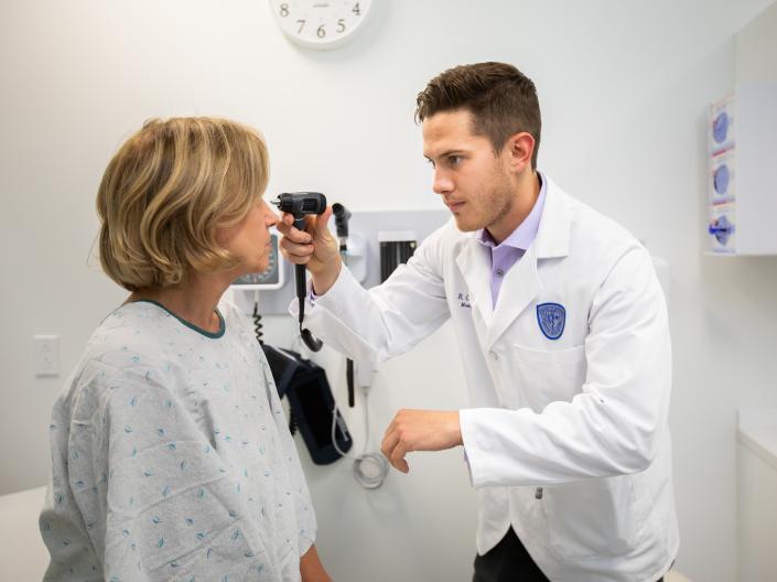 Student with a standardized patient at the simulation center.