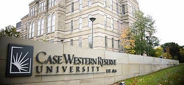 Picture of building with low stone wall in forefront with logo and title Case Western University Est 1826