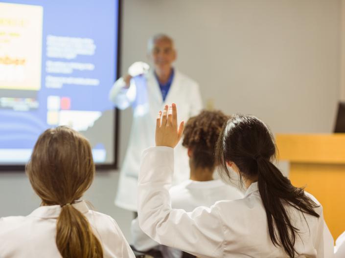 Professor lecturing in front of a classroom