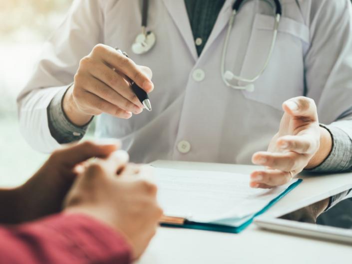 A doctor talking to a patient.