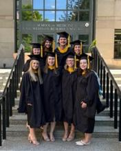Kayla Johnson, Brynn Riley, Christina Mealwitz, Erin Soule, Natali Semerad, Sydney Bruggeman, Justin Yeater and Hannah Singerline stand on the front steps of the Biomedical Research Building