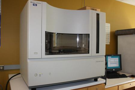 Image of large white genetic analyzer on a table in an office setting