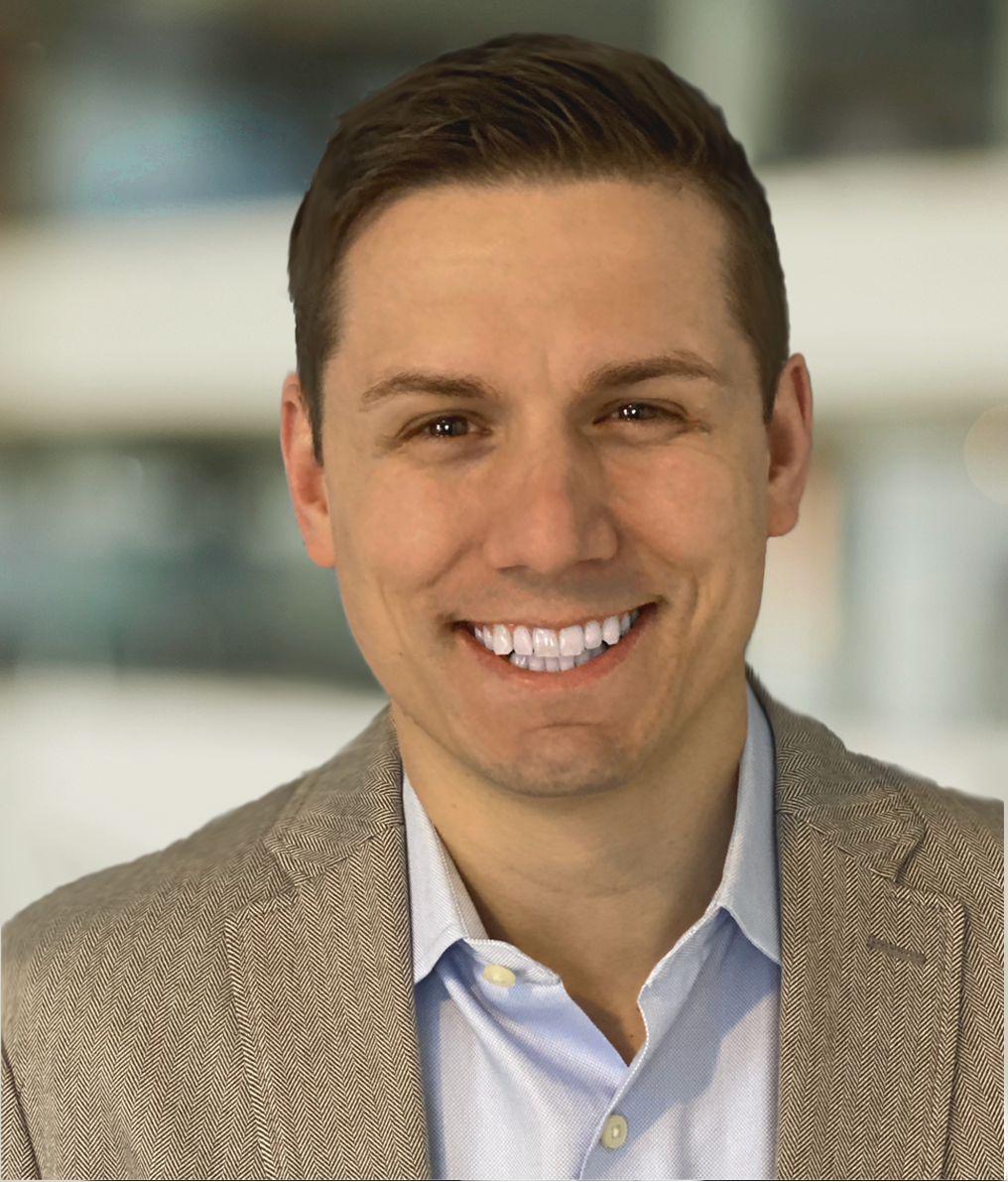 A headshot of Ben Clayton