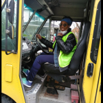 Delores Collins in a truck delivering food to her community