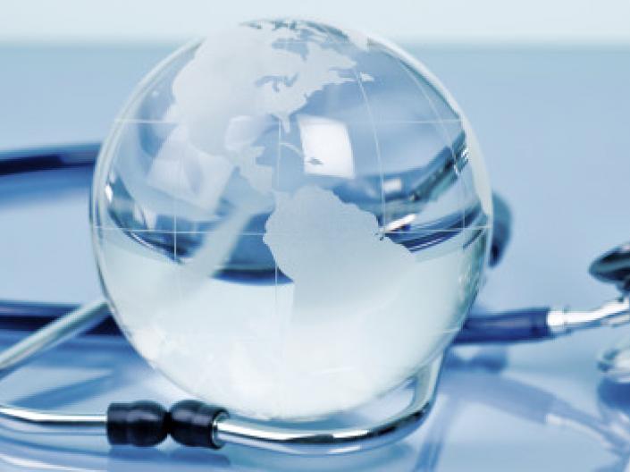 a small globe with a stethoscope wrapped around it
