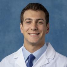 person in white coat