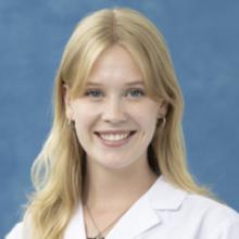 person in white coat