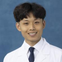 person in white coat