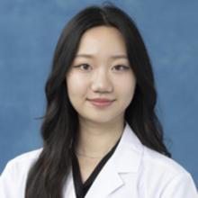 person in white coat