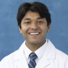person in white coat
