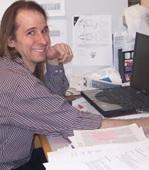 Jonathan sitting at his desk.