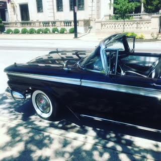 Black vintage car parked on the street