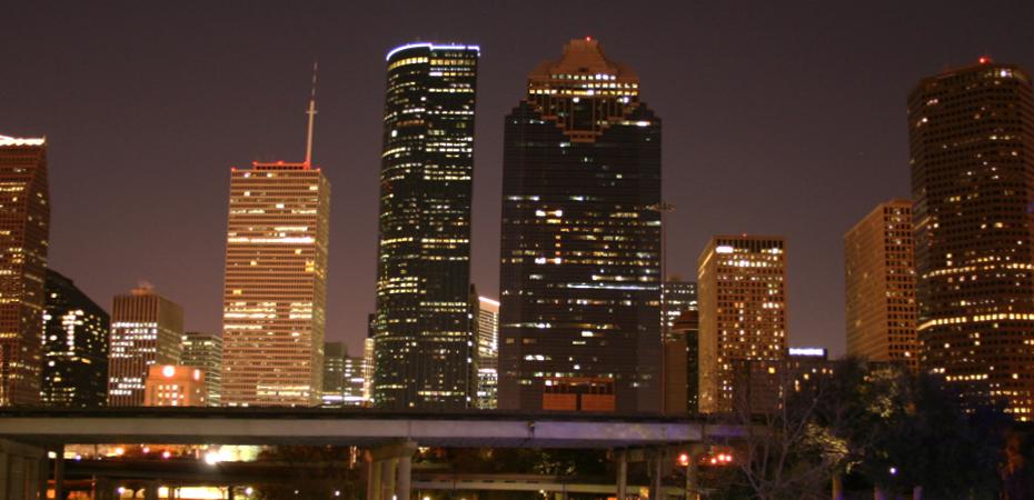 Image of dowtown Houston Texas USA skyline at night with freeway in foreground