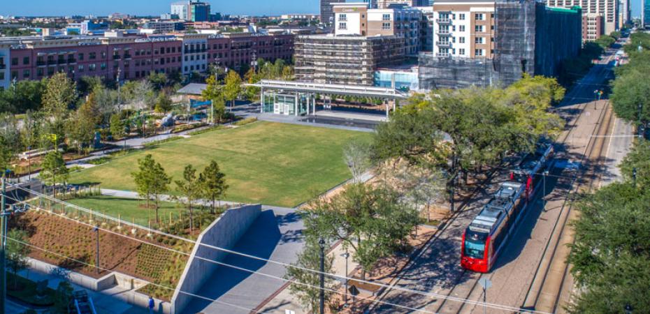 Train in Midtown with view of downtown Houston, Texas in background