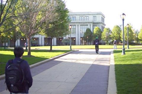 Male students walking to Kelvin Smith Library at Case Western Reserve University