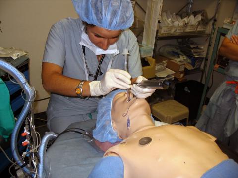 Case Western Reserve University Master of Science in Anesthesia female student intubating mannequin trainer in simulation lab