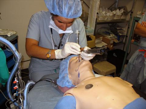 Case Western Reserve University Master of Science in Anesthesia female student intubating mannequin trainer in simulation lab