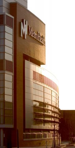 MetroHealth hospital building at sunset